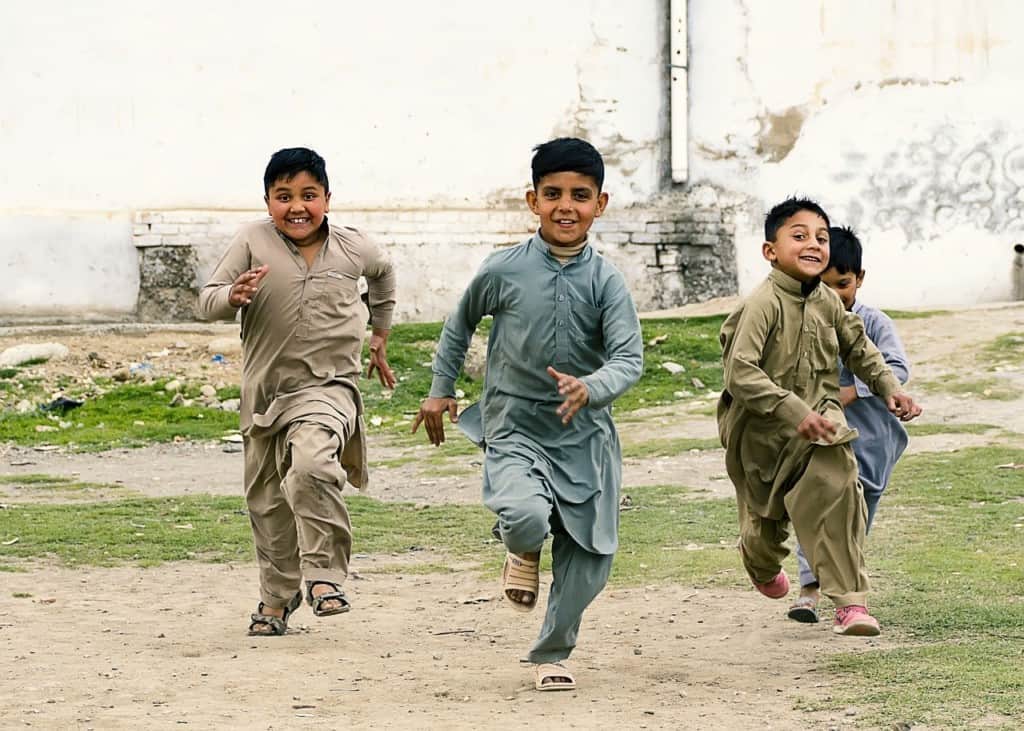 Children running towards the camera in Pakistan