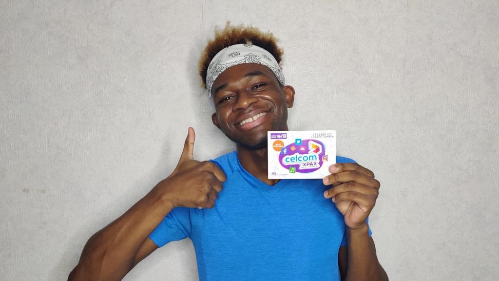 A happy Adu with his Celcom SIM card