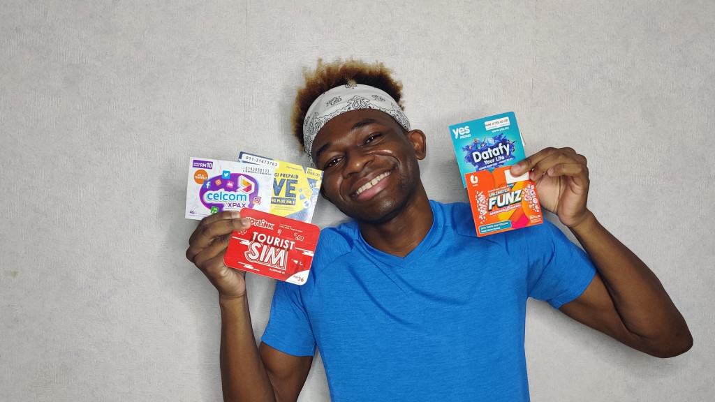 A happy Adu with his Malaysian SIM Cards